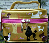 Pug and Pet Cosmetic 6 is from the Fluff Poochy series - a variety of toy breeds including a pug on a metallic gold with hot pink lining, interior mirror, and double zippered closure. Measures 6.00" X 4.00" X 4.00" (15.24 X 10.16 X 10.16 cm). 