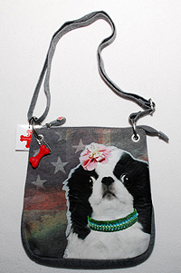 Japanese Chin Purse 1 has a girl Japanese Chin image on multi-colored hoodie material with adjustable shoulder straps and red dog bone accent. Measures 11.00" X 10.00" (27.94 X 25.40 cm).