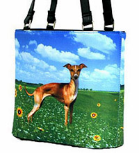 Greyhound Purse 1 is a Microfiber Greyhound bucket handbag featuring a beautiful Greyhound against a blue sky and green grass background. Measures 10.50" X 9.50" (26.67 X 24.13 cm).