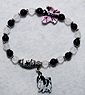 Japanese Chin Bracelet 1 - Genuine Onyx and rose Quartz beads culminate to a delicate pink and black porcelain butterfly and are completed with a black and white Japanese Chin charm.