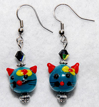Kitty Earrings 4 features teal blue Lampwork kitty beads with charming detail are topped with aurora borealis Swarovski crystals.