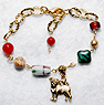 Pug Bracelet 7 - Pug Bracelet 7 - This gold plated chain features genuine Carnelian, Jasper, antique African wood, Czech glass, and a gold pewter pug charm. Adjusts from 6.75" to 8.25" (17.14-20.95 cm).