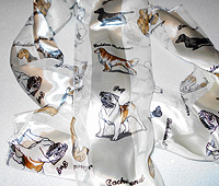 Pug Scarf 3 - This long scarf comes in soft ivory and features many breeds including Pugs, Chows, Afghan Hounds, Bichons, Poodles, and Boxers. Measuring 58' long X 13" wide (147.32 X 33.02 cm).